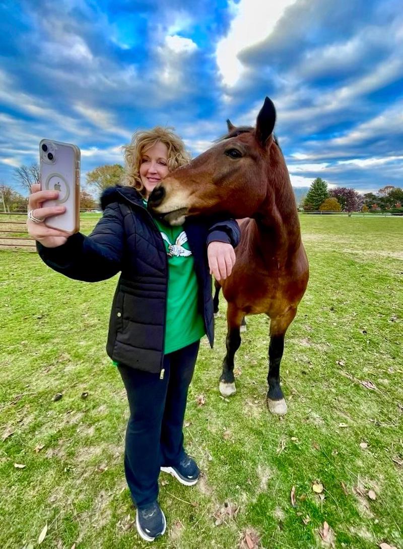 candid girl horse selfie