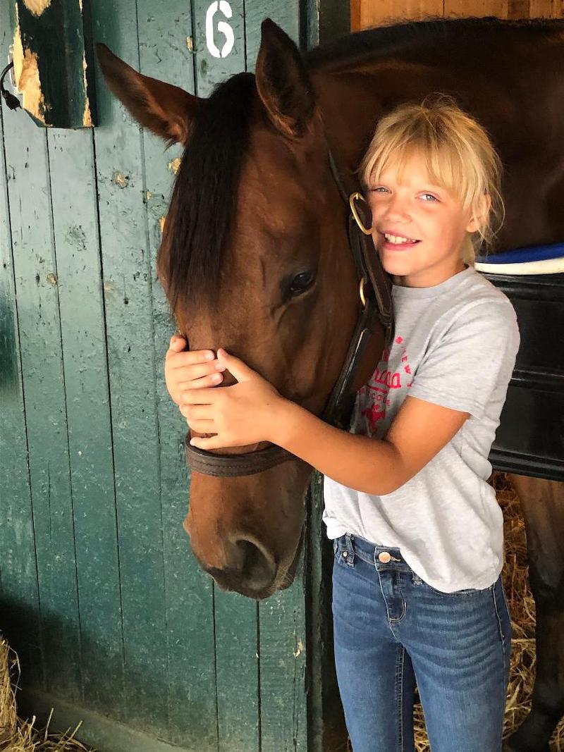 candid girl armsaroundhorses nose KarenKohn