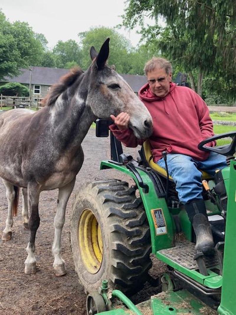 candid man on tracter w ass Cobb